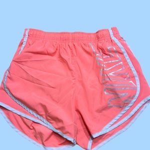 Neon Nike athletic running shorts